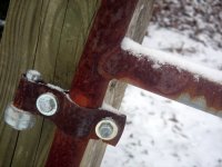rusted gate with snow